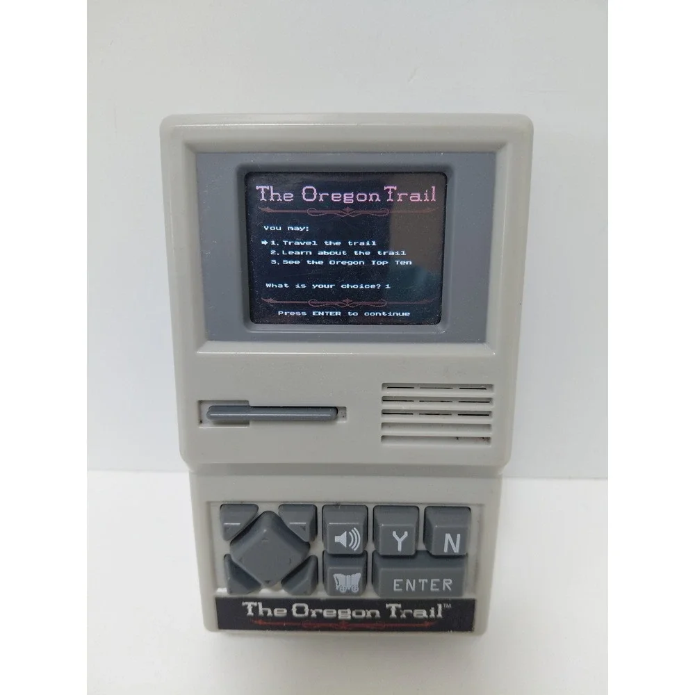 The Oregon Trail Handheld Electronic Game Basic Fun 09597 Retro Travel Toy Grey